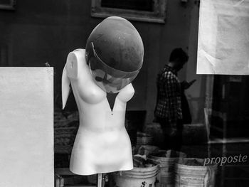 Rear view of man holding woman standing outdoors