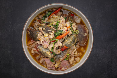 Pad ka prao kai yeow ma, thai food, basil stir fried century egg with pork and ham, top view