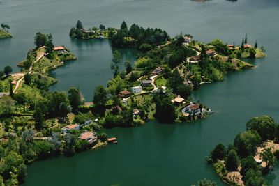 High angle view of trees by river against sky