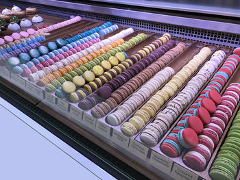 High angle view of multi colored macaroons in store