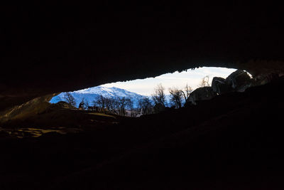 Scenic view of snow covered mountain against sky at night