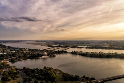 High angle view of river against sky at sunset