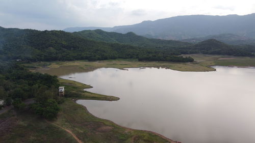 Scenic view of lake and mountains against sky