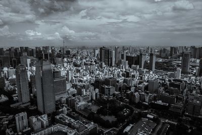 Aerial view of cityscape against sky