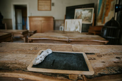 Close-up of messy table with slate at home