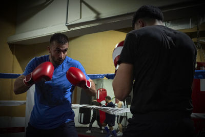 Two boxers training on a ring