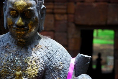 Close-up of bronze statue at mueang sing historical park