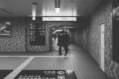 Woman standing on subway station