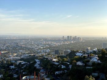 High angle view of buildings in city against sky