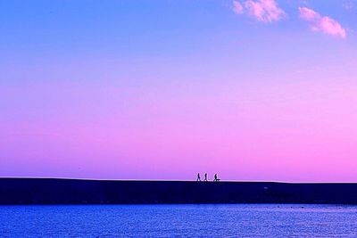 Scenic view of sea against sky at night