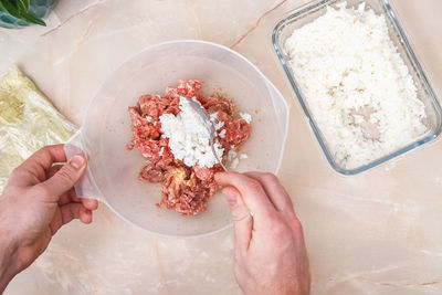 Cropped hands of person preparing food