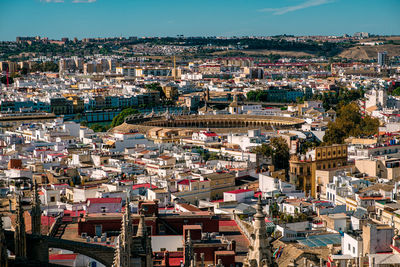 High angle view of townscape and historic city center against sky