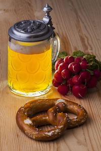 Pretzel and radishes on table