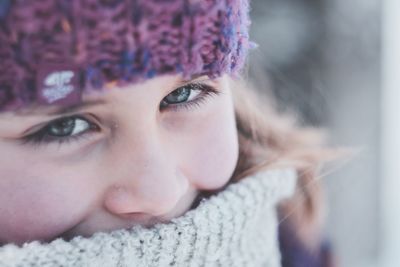 Close-up portrait of cute girl wearing warm clothing during winter