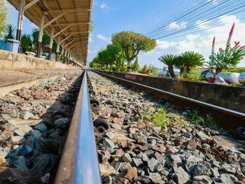 Surface level of railroad tracks against sky