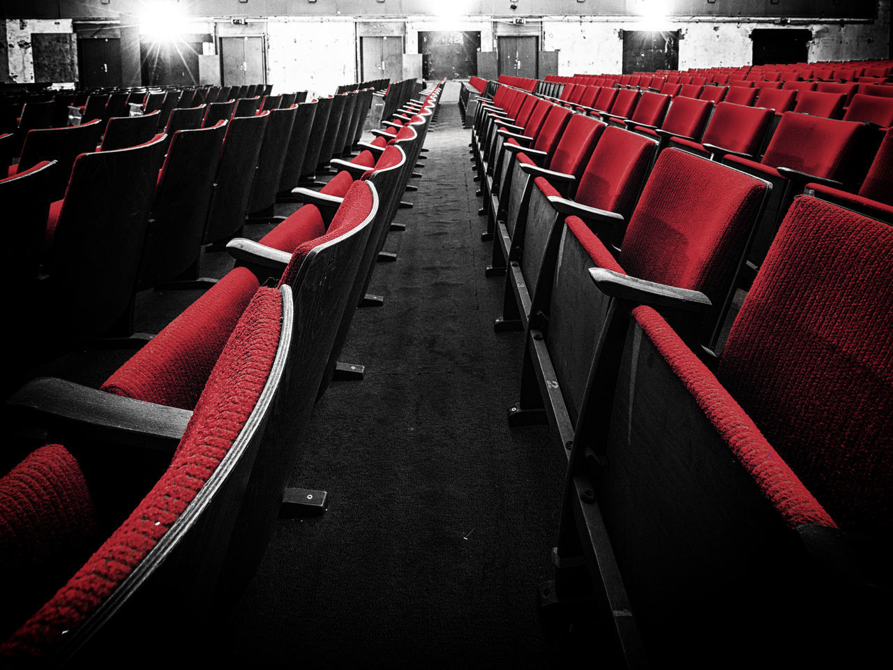 in a row, seat, empty, red, chair, movie theater, absence, no people, repetition, arts culture and entertainment, large group of objects, arrangement, indoors, side by side, order, architecture, auditorium, day, theater, film industry, aisle