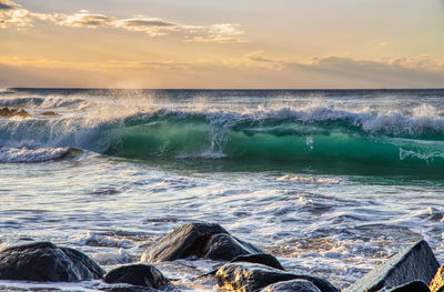 Scenic view of sea against sky during sunset