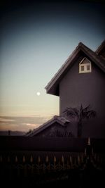 Built structure against sky at sunset