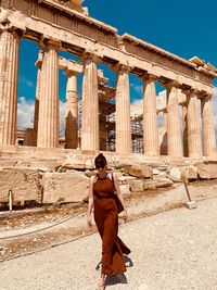 Full length of man standing at historical building