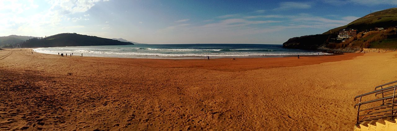 beach, sea, sand, water, shore, horizon over water, sky, scenics, tranquil scene, tranquility, beauty in nature, incidental people, nature, coastline, vacations, idyllic, cloud - sky, outdoors, day, person