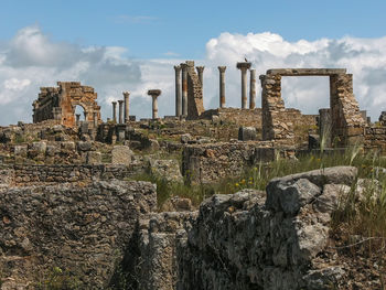 View of old ruins against cloudy sky