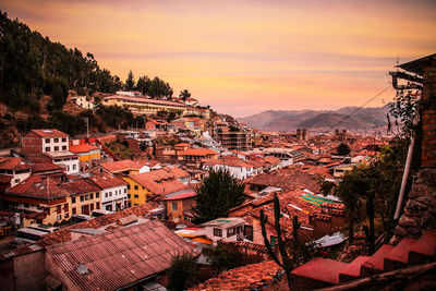 High angle view of town against sky during sunset