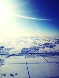 Scenic view of snow covered landscape against sky