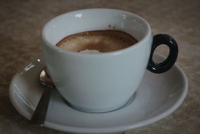 Close-up of coffee cup on table