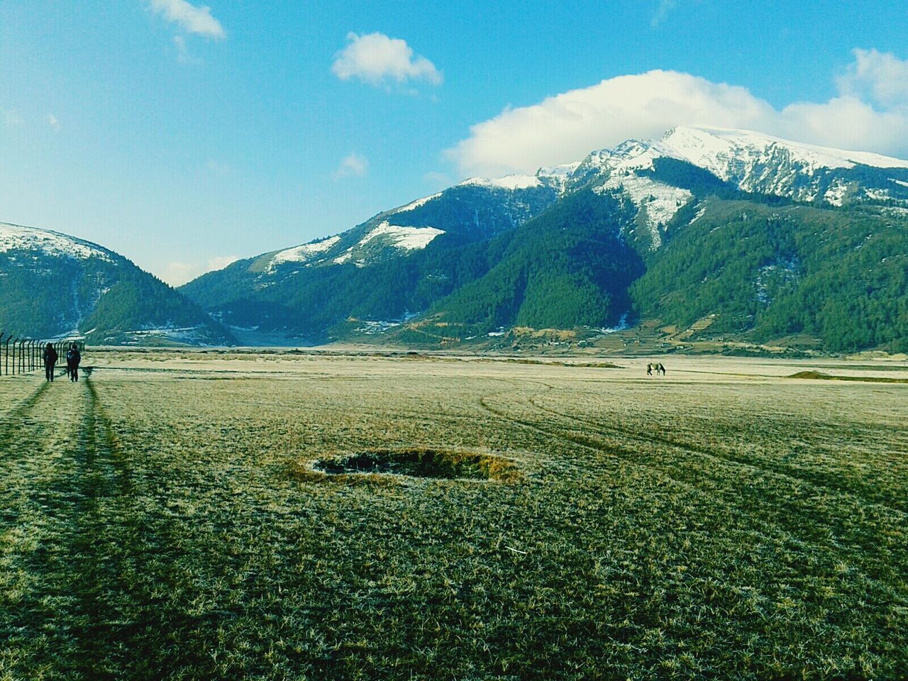 mountain, mountain range, landscape, tranquil scene, tranquility, scenics, sky, beauty in nature, snowcapped mountain, snow, nature, grass, winter, non-urban scene, cold temperature, field, season, remote