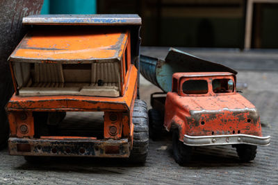 Close-up of rusty toy cars on table