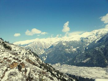 Scenic view of mountains against sky during winter