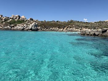 Scenic view of sea against clear blue sky