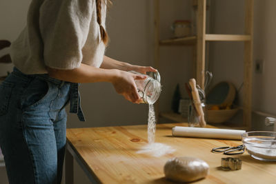 Young woman making christmas cookies