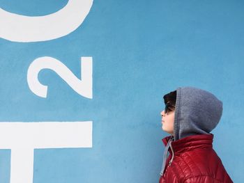 Boy with red umbrella