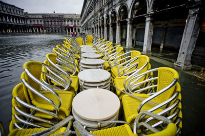 High angle view of chairs and tables on flooded street
