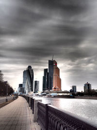 City skyline against cloudy sky