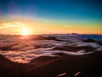 Scenic view of mountains against sky during sunset