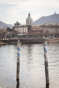 Wooden post in front of church against sky