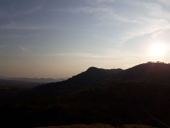 Scenic view of silhouette mountains against sky during sunset