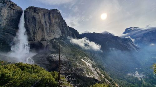 Scenic view of waterfall against sky, yosemite falls