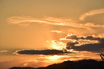 Low angle view of dramatic sky during sunset