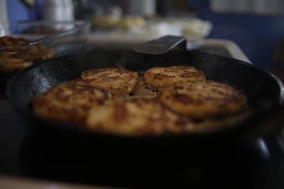 Close-up of food frying in pan