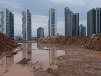 Buildings in city against sky