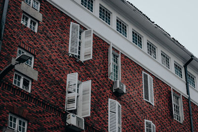 Low angle view of red building against sky