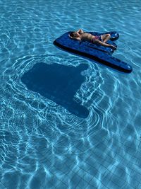 High angle view of man swimming in pool