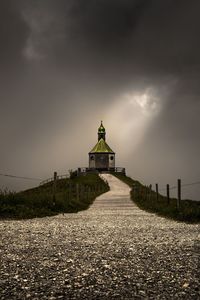 Church by building against sky