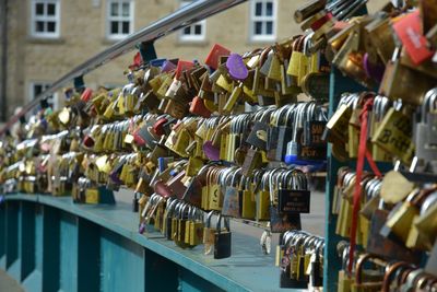 Close-up of padlocks on railing