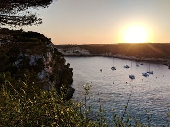 Scenic view of sea against clear sky during sunset