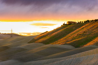 Scenic view of landscape against sky during sunset