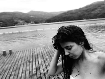 High angle view of woman looking away at beach